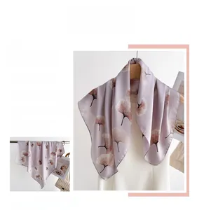 Detailed texture of lavender silk scarf with white ginkgo leaf patterns and smooth drape