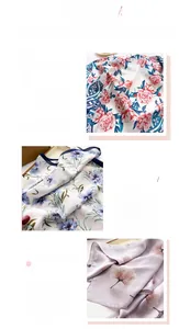 Detailed view of floral silk scarves showing high-quality printing and rolled hem edges