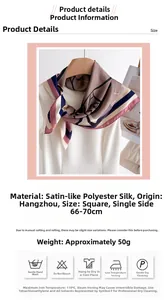 Detail of silk-like satin scarf with geometric floral print draped on white garment