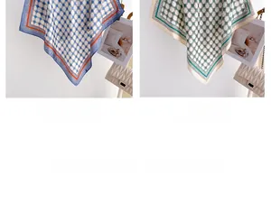 Close-up of geometric silk scarves in blue and beige with chic polka dot patterns