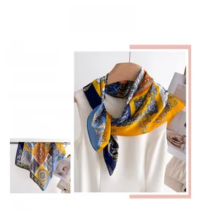 Detail of vintage Baroque floral silk scarf tied elegantly on a white garment collar