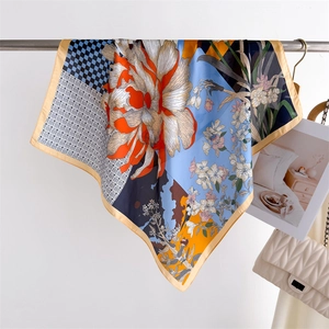 Artistic floral print silk square scarf with geometric patchwork and gold border edge