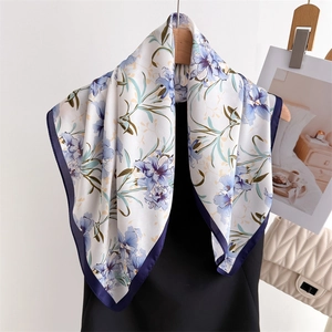 Elegant floral silk square scarf with blue and purple flowers on a white background