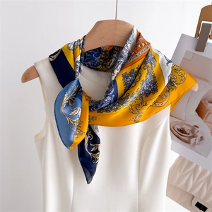 Elegant Baroque Paisley silk scarf with blue and yellow prints on white dress neck