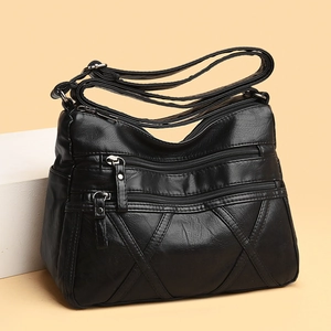 Sac bandoulière en cuir souple noir pour femme avec poches zippées et coutures en V