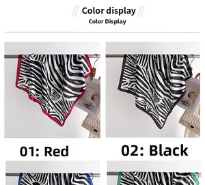Detail view of stylish zebra print silk scarves with red and black border color options