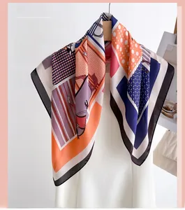 Detailed view of the silk scarf featuring equestrian prints and vibrant geometric patterns