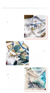 Detail view of fine digital printing on lightweight square silk-like scarf with lotus patterns