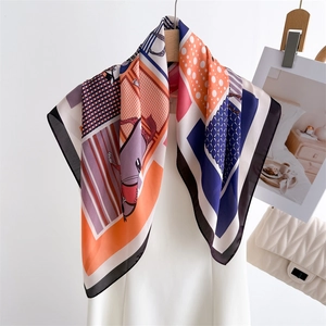 Elegant silk scarf with vintage geometric polka dot and equestrian patterns on hanger