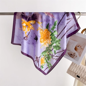 Detail of silk scarf with ink lotus floral print and fine purple hemmed edges
