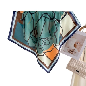 Modern floral silk scarf with green and orange abstract rose print for elegant women