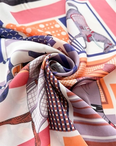 Close-up of silk square scarf featuring vintage equine motif and geometric prints