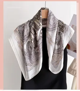 Close-up of elegant architectural print silk scarf draped on a black mannequin