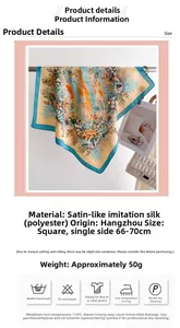 Detail of colorful floral satin scarf with warm orange and turquoise flower patterns