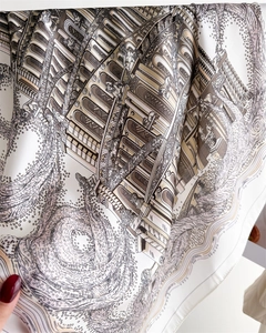 Detail view of architectural print silk scarf showing exquisite classical pillars and drapes
