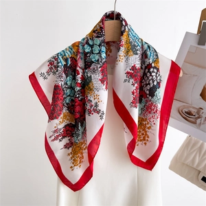 Elegant floral print silk scarf for women featuring vibrant red borders and flower patterns