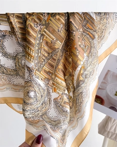 Detailed view of silk scarf with classical architectural prints and mythological motifs