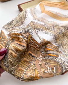 Detail of silk scarf showing classical architectural prints and baroque patterns