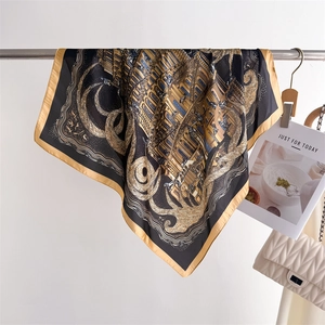 Luxurious architectural print silk scarf with gold border on a minimalist background