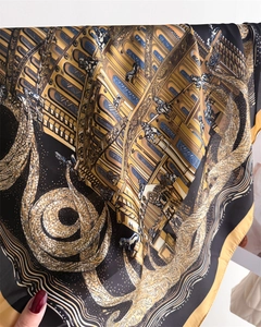 Close-up of vintage architectural silk scarf showing detailed horse and animal prints