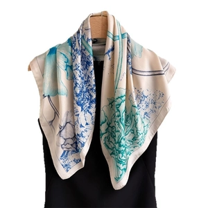 Ink lotus pattern silk scarf displayed on a mannequin with elegant artistic design