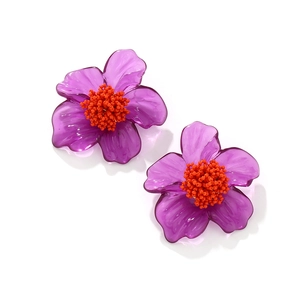 Handmade bohemian purple resin flower earrings with orange beaded stamens and clear petals