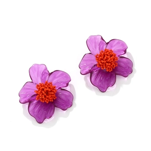Bohemian purple resin flower earrings with orange beaded center on white background