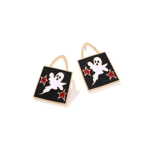 Detail of square black enamel earrings with white ghosts and red stars for Halloween