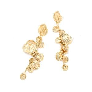 Macro detail of gold layered hammered metal petal earrings with tassel chain design