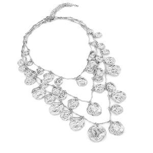 Detailed view of triple-layered silver necklace with hammered irregular round charms