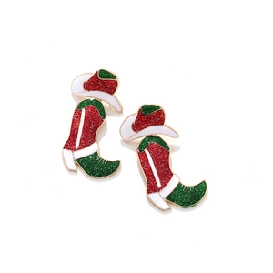Detailed view of Christmas cowboy boot earrings with red and green glitter enamel finish