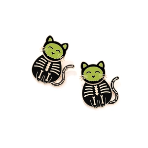 Cute black enamel cat earrings with green eyes and white skeleton bones for Halloween