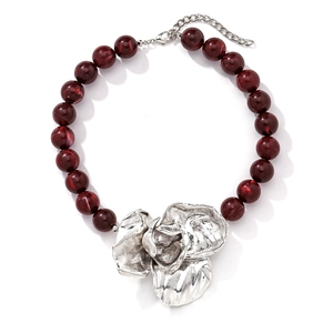 Retro beaded necklace with dark red beads and a large silver sculptural flower pendant