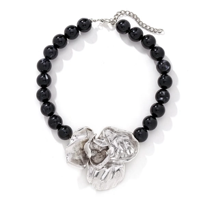 Vintage necklace with oversized silver flower pendant and chunky black resin beads