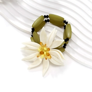 Bohemian multilayer beaded bracelet featuring a 3D white flower on a wavy stand
