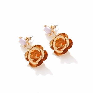 Elegant gold metal camellia earrings with light purple faux pearls on a white background