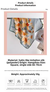 Close-up of elegant floral print scarf in blue and orange with smooth satin texture