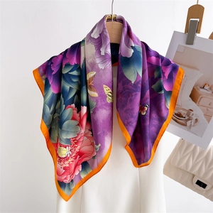 Elegant silk scarf with purple peony and butterfly print and bright orange rolled edges