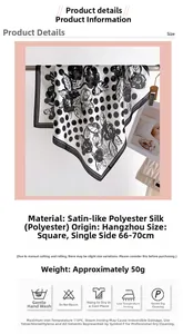 Dettaglio di un foulard in raso a pois e fiori con bordi arrotolati a mano