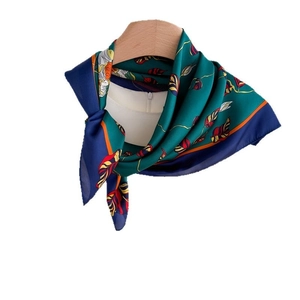 Floral print satin silk scarf for women displayed on a wooden hanger with white background