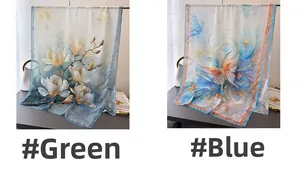 Detail of floral print silk scarves in elegant green and blue gradient patterns