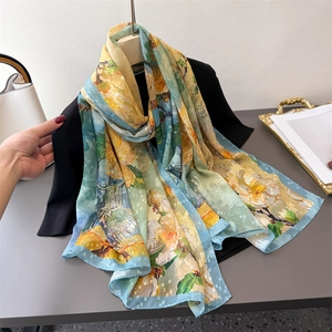 Elegant floral print silk scarf with geometric texture for sun protection and travel