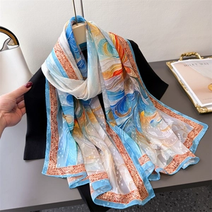 Artistic sky blue and beige floral scarf with abstract print and paisley border