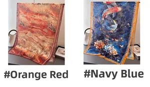 Détail de foulards en soie imprimés avec paysages orange et motifs de carpes koi bleu marine