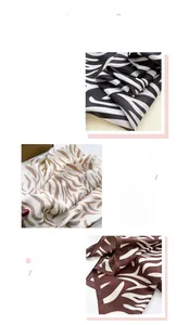 Detail view of fine printing, silky texture and exquisite hem on zebra print silk scarves