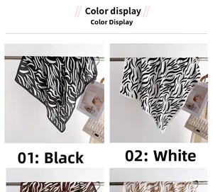 Detail of zebra print silk scarf showing smooth texture and fine hemmed edges