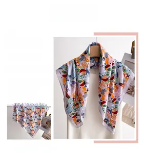 Detail view of the colorful abstract floral print and exquisite hem on purple silk scarf
