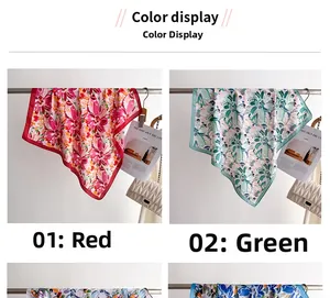Detail display of floral silk scarves in red and green colors hanging on a metal rack