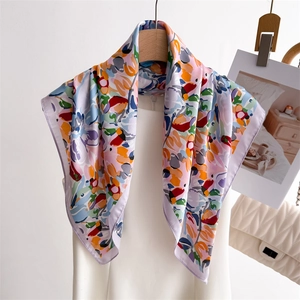 Artistic oil painting silk scarf with multi-color abstract print hanging on a wooden hanger