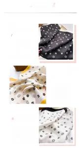 Gros plan sur le foulard en soie imprimé camélia, ourlet fin et texture satinée